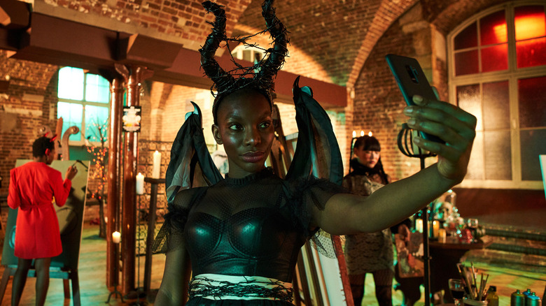 Arabella in a devil costume taking a selfie in I May Destroy You