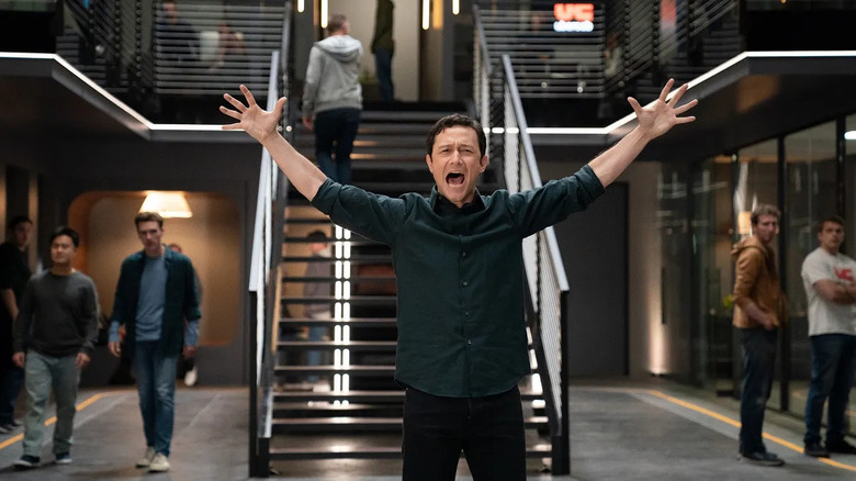 Travis raising his arms and yelling at Uber HQ in Super Pumped