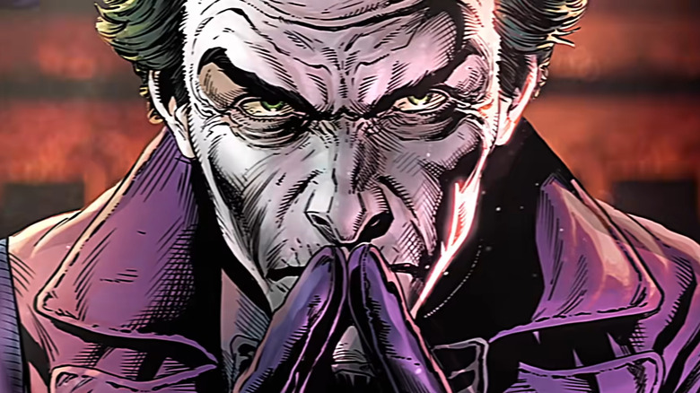 Joker pressing fingers together
