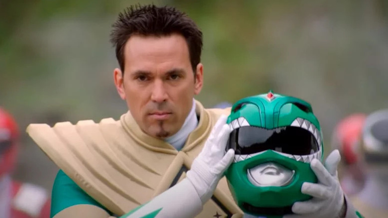 Tommy Oliver holding his Green Ranger helmet on Mighty Morphin Power Rangers