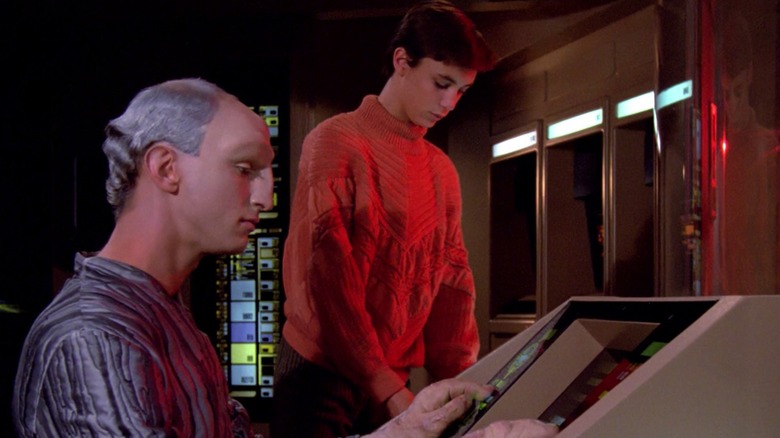 The Traveler uses an interface in engineering next to Wesley Crusher in Star Trek: The Next Generation