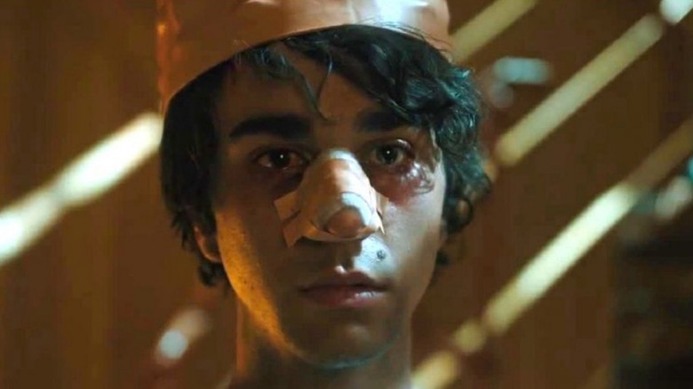 Peter wears a crown and a bandage on his nose in "Hereditary" (2018)