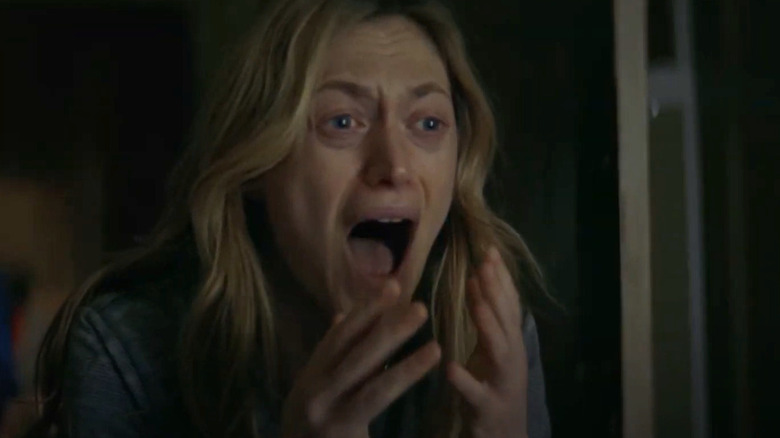 Louise raises her hands and screams in "The Dark and the Wicked" (2020)