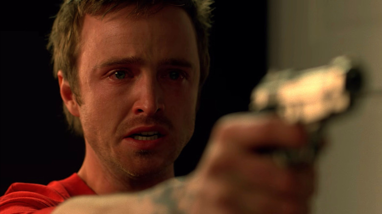 Jesse aiming a gun