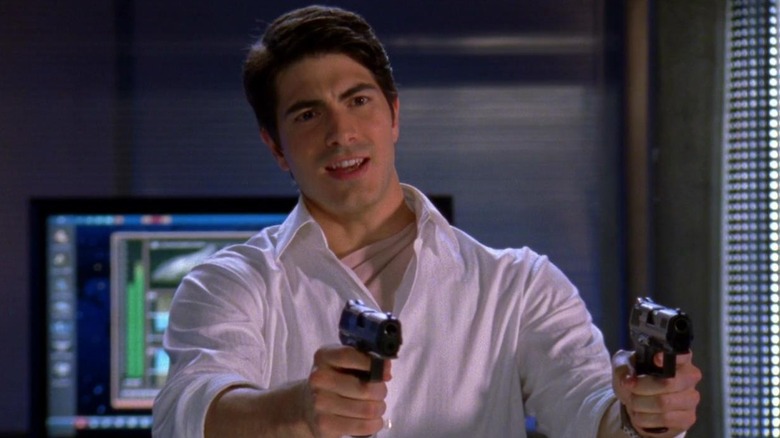 Agent Daniel Shaw holding guns