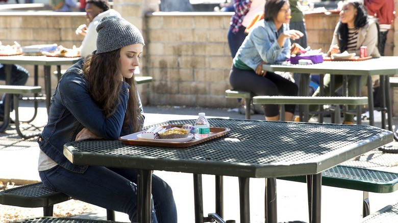 Hannah sitting alone at lunch in "13 Reasons Why" (2017-2020)