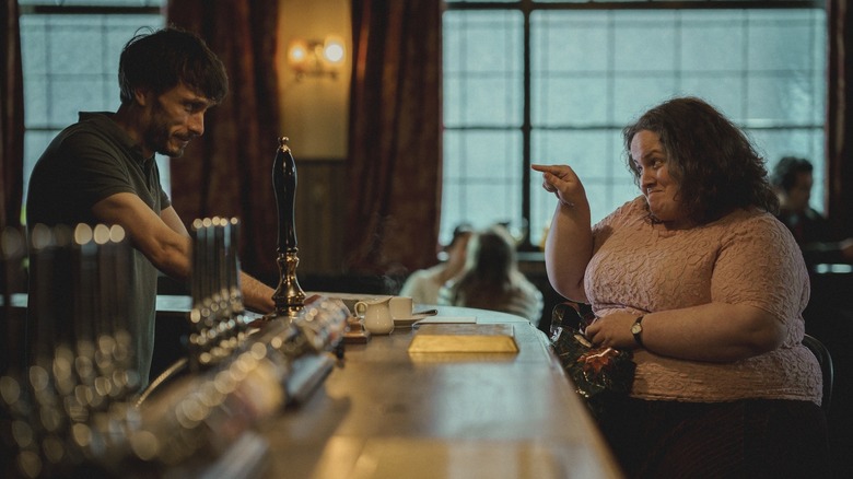 Donny and Martha meet at the bar where Donny works in "Baby Reindeer" (2024)