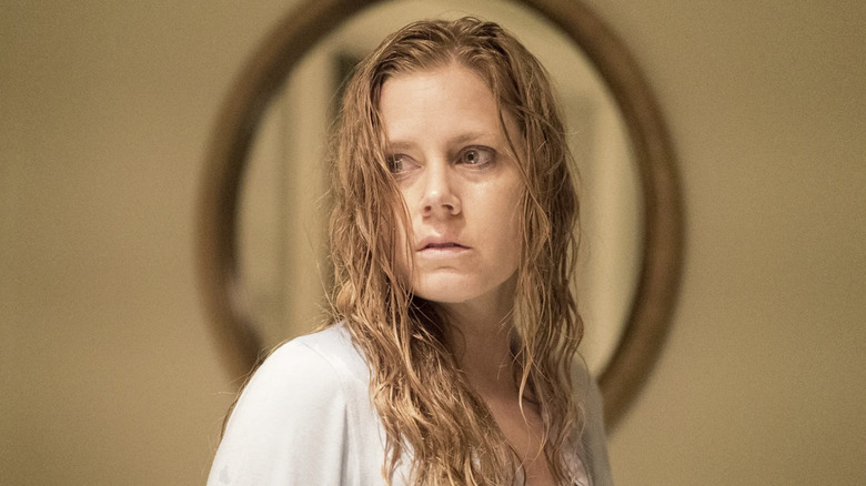 A distraught Camille looks over her shoulder in "Sharp Objects" (2018)