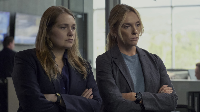 Detectives Duvall and Rasmussen looking at evidence in "Unbelievable" (2019)