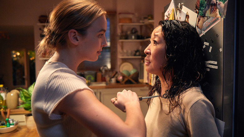 Villanelle holding Eve against a fridge in "Killing Eve."