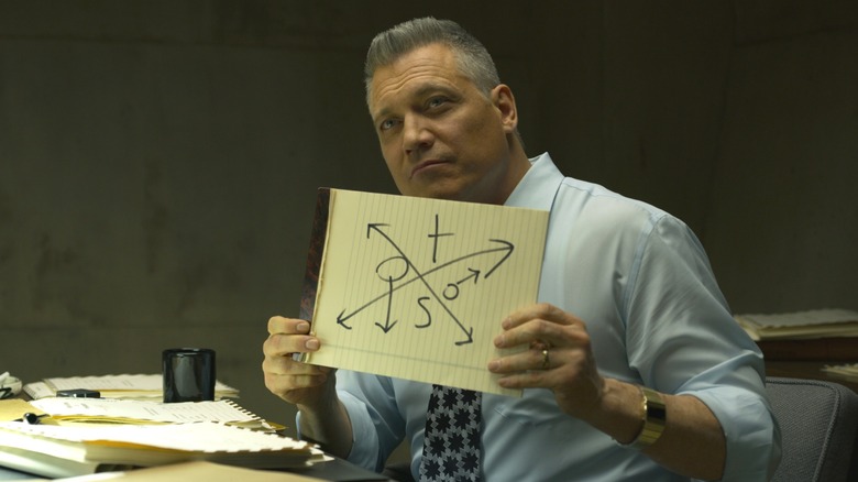 Tench holding a piece of paper in "Mindhunter."