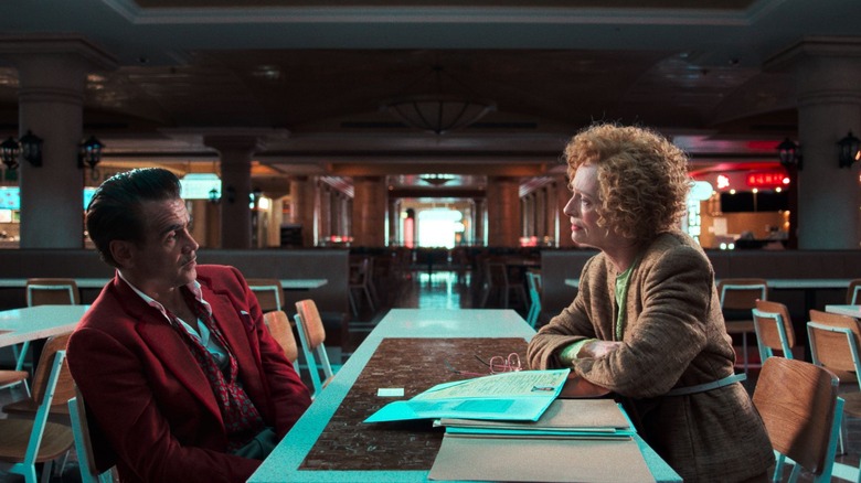 Brendan  Reilly and Cynthia Blithe having a brutal chat in Ballad of Small Player (2025)