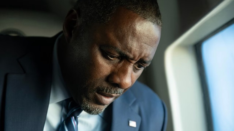 The POTUS bending solemnly next to a window in A House of Dynamite (2025)