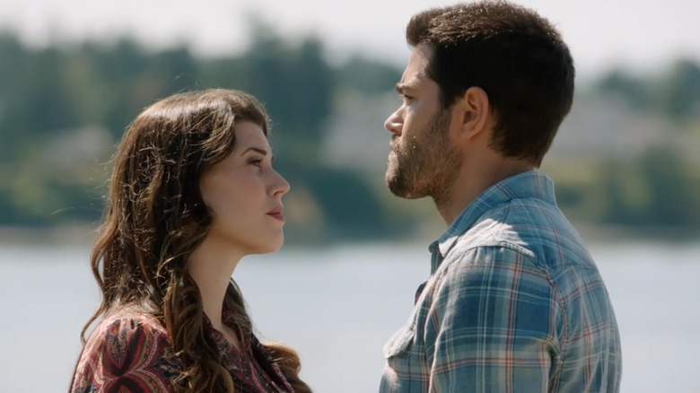 Abby and Trace stand by the lake and look at each other in "Chesapeake Shores" (2016-2022)