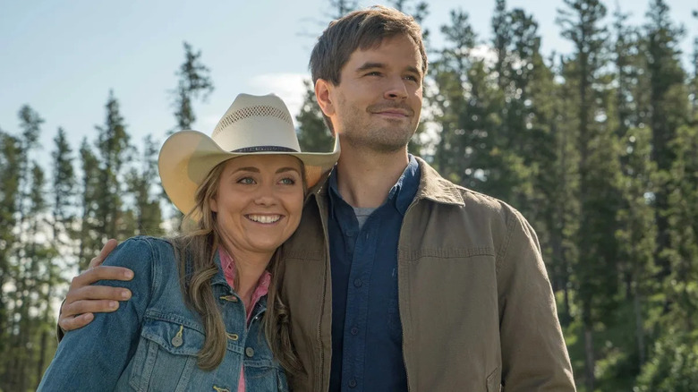 Amy and Ty embrace in front of the forest in "Heartland" (2007-present)