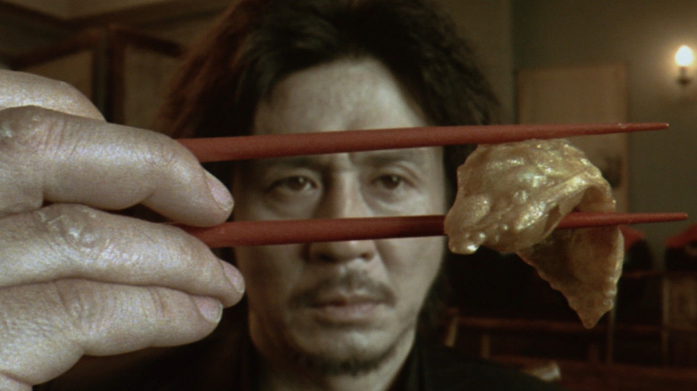 Choi Min-sik eats dumpling in Oldboy