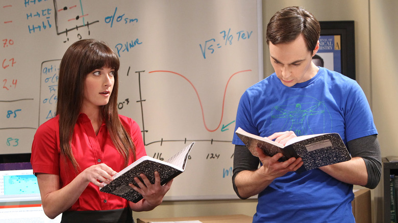 Sheldon and Alex look over some files in "The Big Bang Theory" (2007-2019)