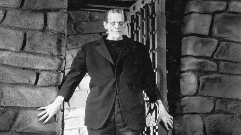 Frankenstein's monster walks through a door in 'Frankenstein' (1931)