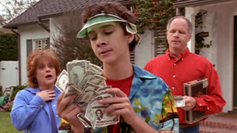 Louis admiring his money in front of his parents in Even Stevens