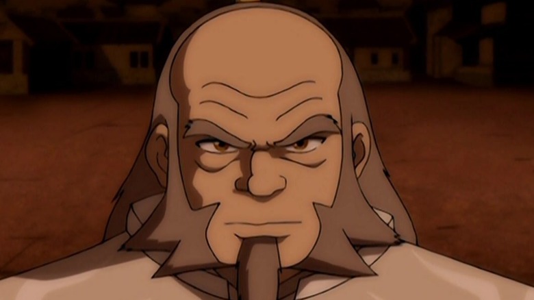 White Lotus Uncle Iroh smirking