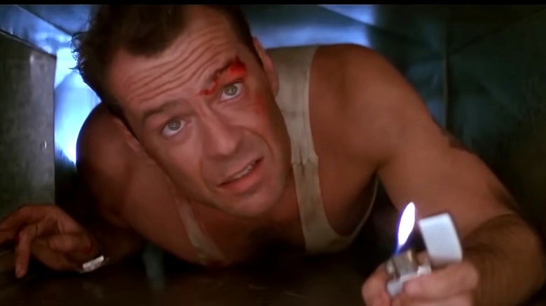 John McClane lighting a match i tunnel in Die Hard