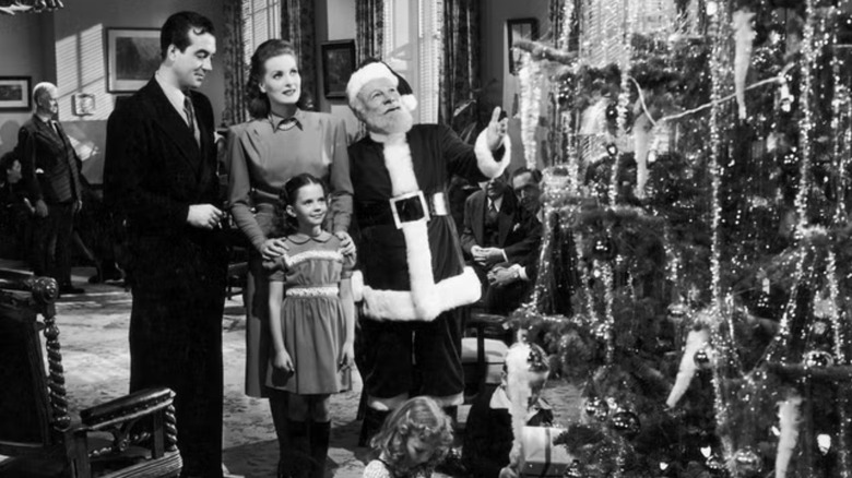 Santa shows the Walker family a Christmas tree in Miracle on 34th Street