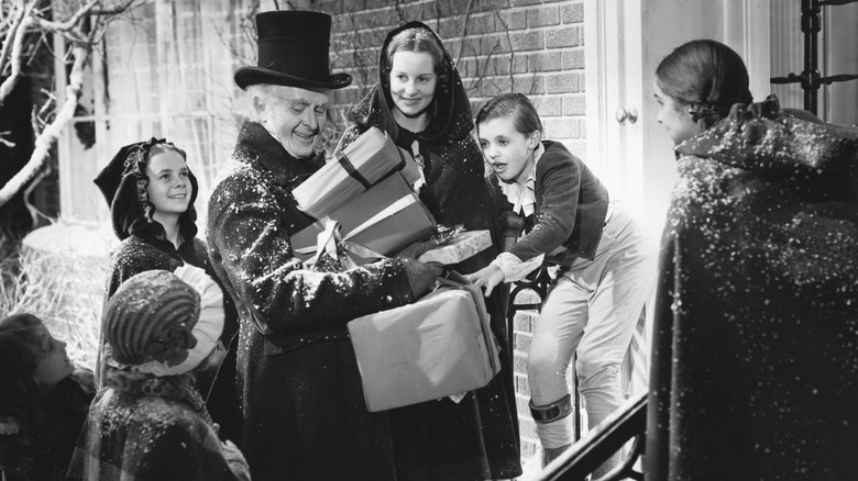 Ebenezer giving out presents in "A Christmas Carol" (1938)