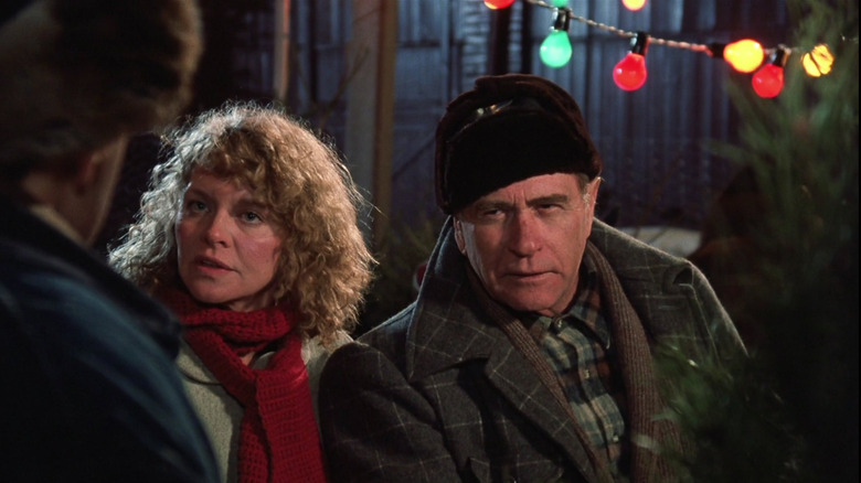 Mr. and Mrs. Parker talking to a man in "A Christmas Story" (1983)