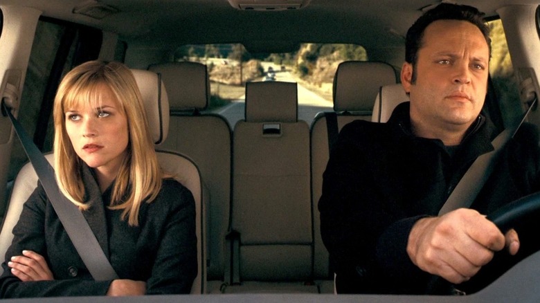 Kate and Brad sitting in a car looking annoyed in "Four Christmases" (2008)