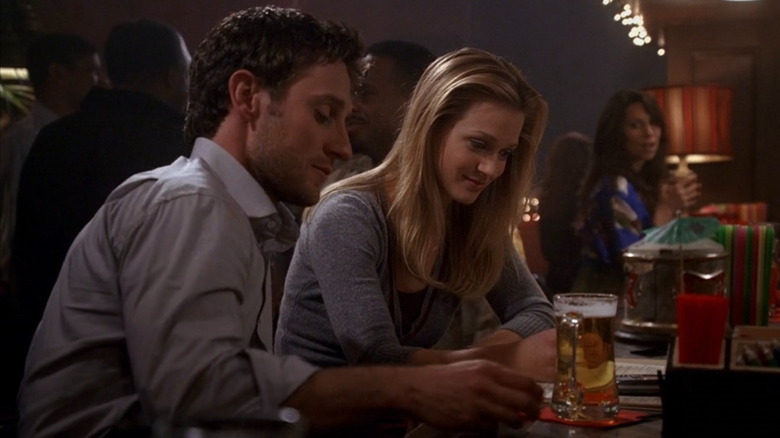 JJ having a drink with New Orleans detective Will LaMontagne Jr.