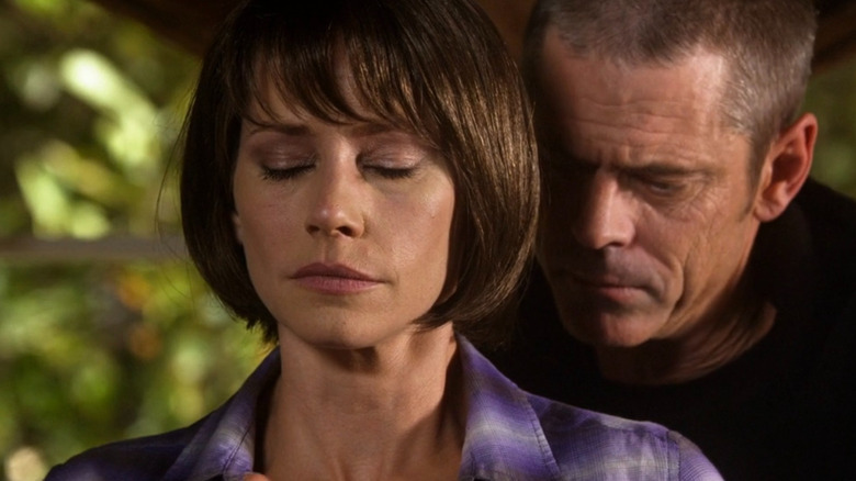 The Reaper standing behind Hotch's ex-wife, Haley