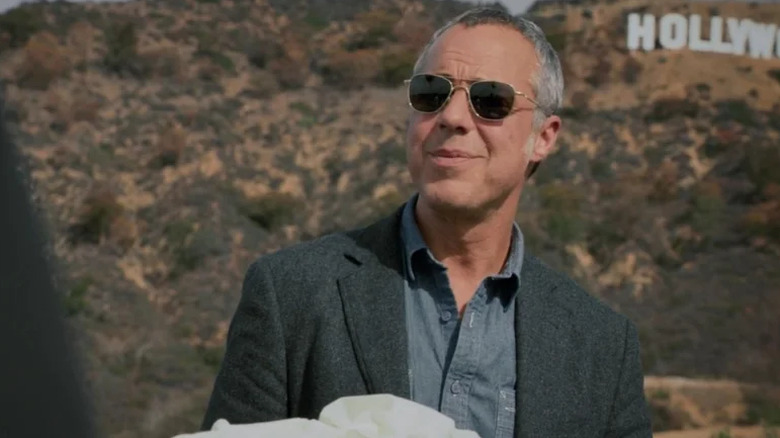 Harry Bosch in glasses in front of the Hollywood sign on Bosch (2014-2021)