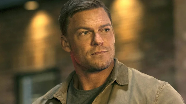 Jack Reacher looks off-camera on Reacher (2022-present)