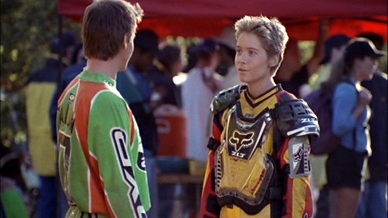 Dean Talon stands across from Andrea Carson disguised as Andrew Carson in Motocrossed