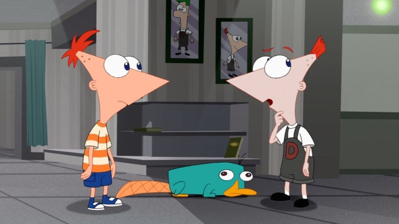 Phineas stands across from an alternate version of Phineas with Perry the Platypus standing between them in Phineas and Ferb The Movie: Across the 2nd Dimension