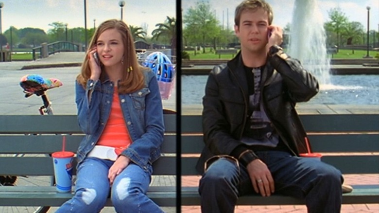 Brittany Aarons and Jordan Cahill both sit on benches while on the phone Stuck in the Suburbs