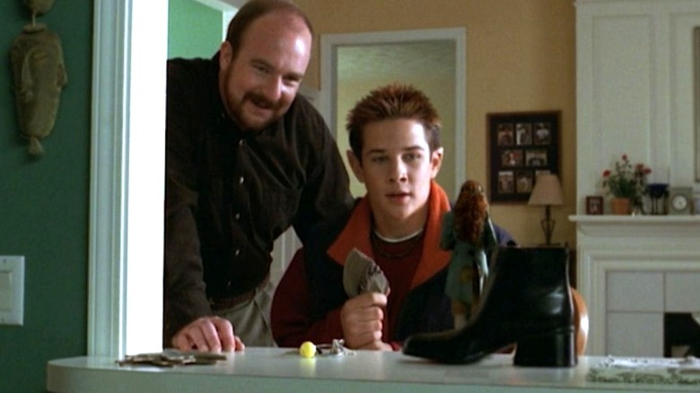 Bob Johnson stands next to Kyle Johnson as they both look at Kate O'Reilly Johnson in The Luck of the Irish