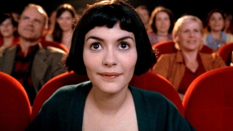 Amélie happily watching a movie in "Amélie"