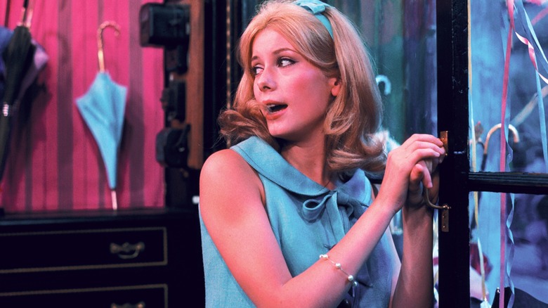 Geneviève Émery in a shop in "The Umbrellas of Cherbourg"