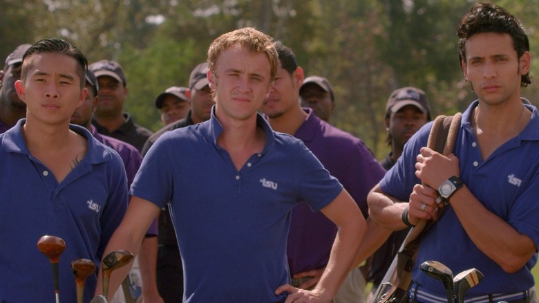 Young golfers watching a tee off