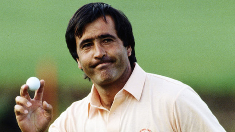 Seve holding up ball