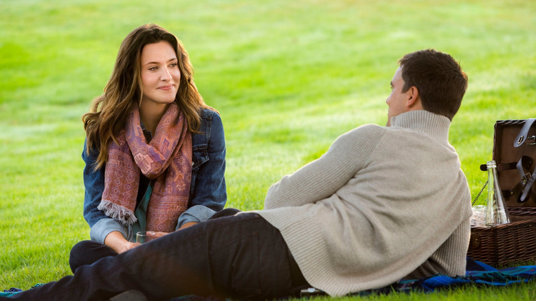 Annie and Ben have a picnic in the grass.