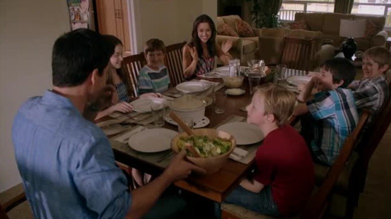 Gina and her family sit around the dinner table