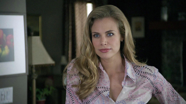 Jennifer smirks, with a sassy attitude.