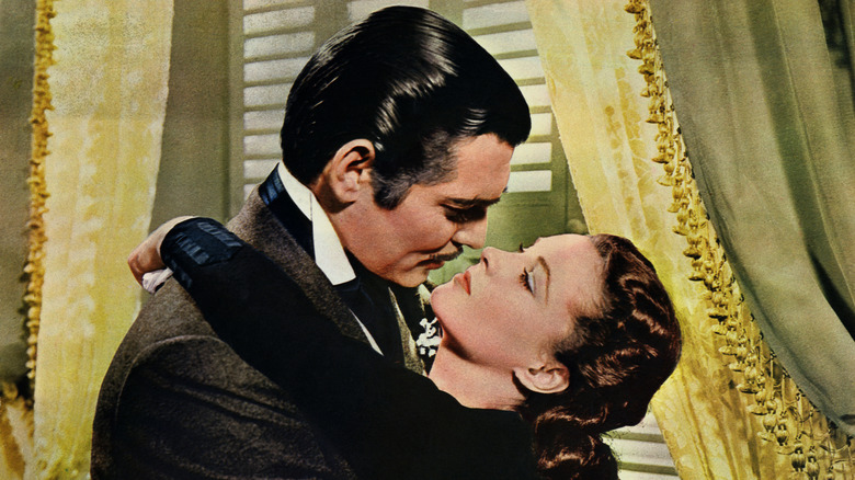 Rhett Butler embraces Scarlett O'Hara in "Gone with the Wind" (1939)