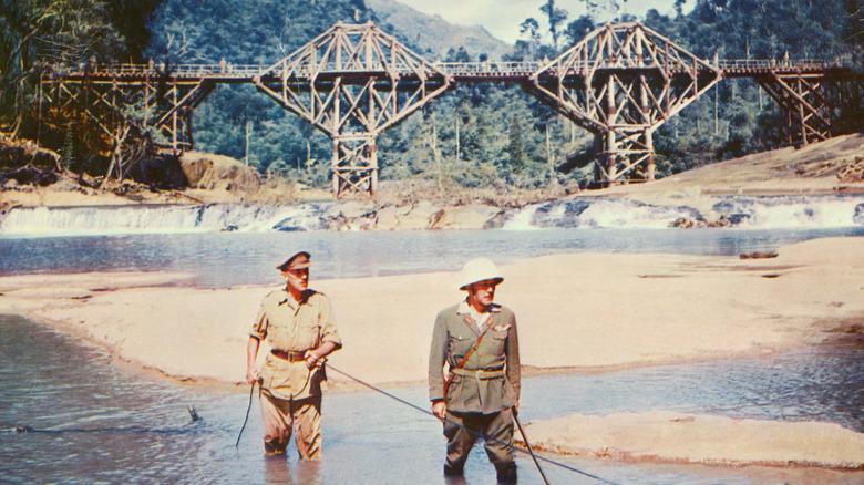 Col. Nicholson wades through water in "The Bridge on the River Kwai" (1957)