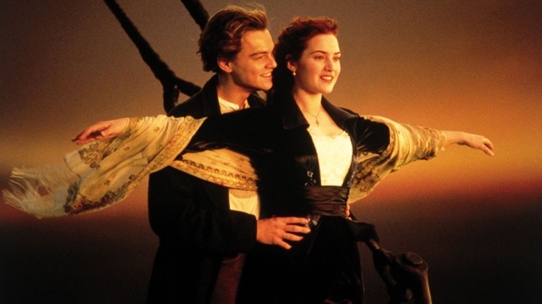 Jack holds Rose on the tip of the ship in "Titanic" (1997)