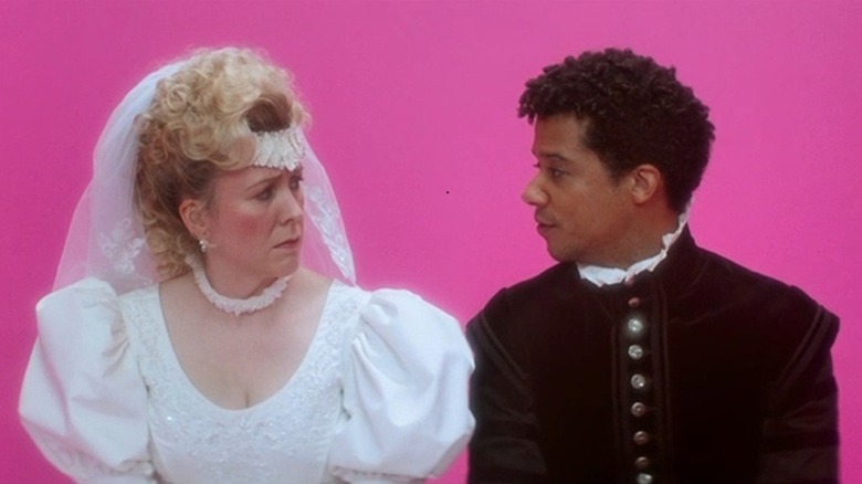 Agnes talks to Scipio in a pink dream state in "Timestalker" (2024)