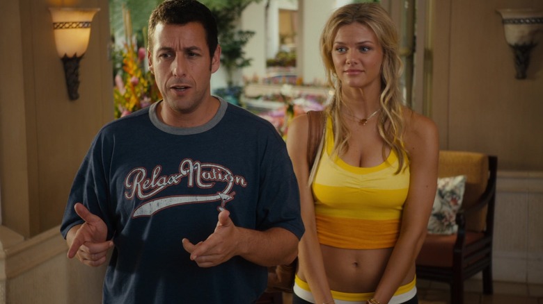 Palmer stands behind Danny as he talks in Just Go with It (2011)