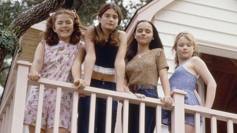 Ashleigh, Samantha, Roberta, and Teeny look down from a treehouse in Now and Then (1995)